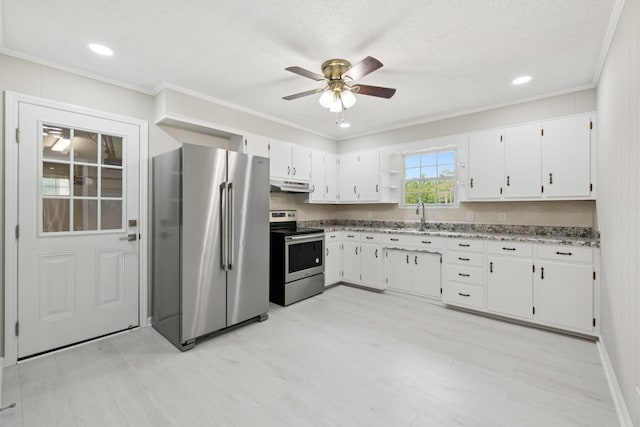 2762 Hunters Point Pike, Lebanon, TN 37087 - kitchen with stainless steel appliances, under cabinet range hood, ornamental molding, ceiling fan, and white cabinets