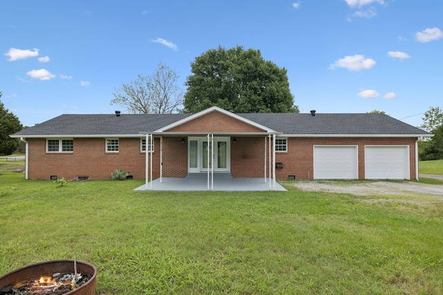 2762 Hunters Point Pike, Lebanon, TN 37087 - back of property with a garage, a yard, brick siding, and dirt driveway