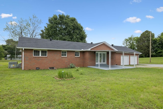 2762 Hunters Point Pike, Lebanon, TN 37087 - view of front of home featuring french doors, a garage, concrete driveway, a front lawn, and brick siding