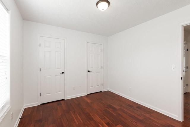5026 Hectare Ln, La Vergne, TN 37086 - unfurnished bedroom with dark wood-type flooring and baseboards