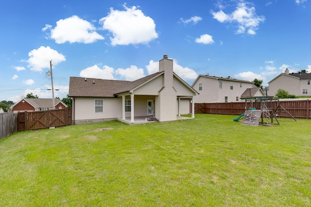 5026 Hectare Ln, La Vergne, TN 37086 - back of property with a playground, a patio, a chimney, and a gate