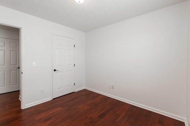 5026 Hectare Ln, La Vergne, TN 37086 - unfurnished bedroom with baseboards, dark wood-style flooring, and a closet