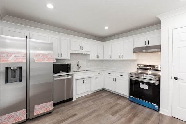 5026 Hectare Ln, La Vergne, TN 37086 - kitchen featuring appliances with stainless steel finishes, a sink, under cabinet range hood, white cabinets, and recessed lighting