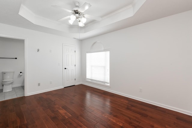 5026 Hectare Ln, La Vergne, TN 37086 - unfurnished bedroom featuring a tray ceiling, ornamental molding, wood-type flooring, baseboards, and ensuite bath