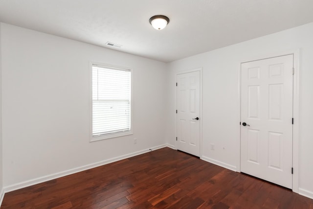 5026 Hectare Ln, La Vergne, TN 37086 - unfurnished bedroom featuring dark wood-style floors and baseboards