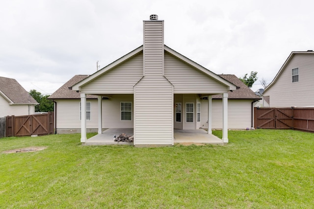 5026 Hectare Ln, La Vergne, TN 37086 - rear view of property featuring a gate, a patio area, a chimney, and roof with shingles