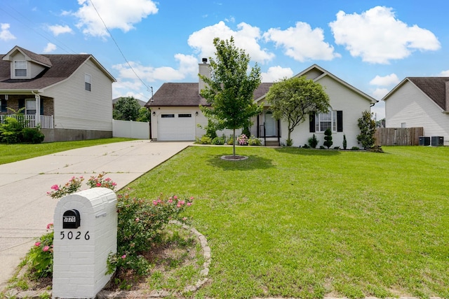 5026 Hectare Ln, La Vergne, TN 37086 - view of front of house with a chimney, concrete driveway, central air condition unit, and an attached garage