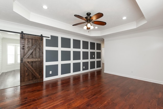 5026 Hectare Ln, La Vergne, TN 37086 - unfurnished room featuring a barn door, a raised ceiling, a ceiling fan, hardwood / wood-style flooring, and crown molding