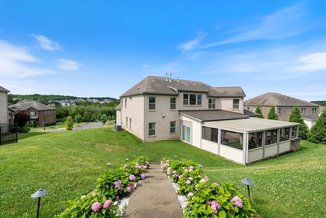 793 Alameda Ave, Nolensville, TN 37135 - rear view of property with a sunroom, a yard, and brick siding