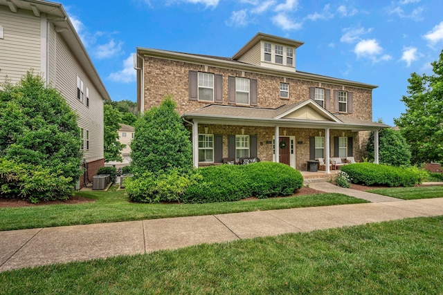 1033 Park Run Dr, Franklin, TN 37067 - american foursquare style home with brick siding, covered porch, and a front yard