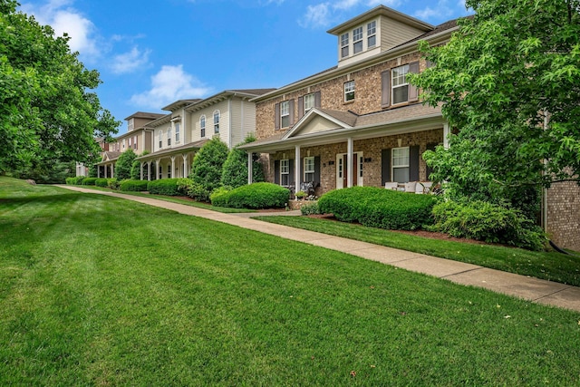 1033 Park Run Dr, Franklin, TN 37067 - view of front facade featuring a front yard, a porch, and brick siding