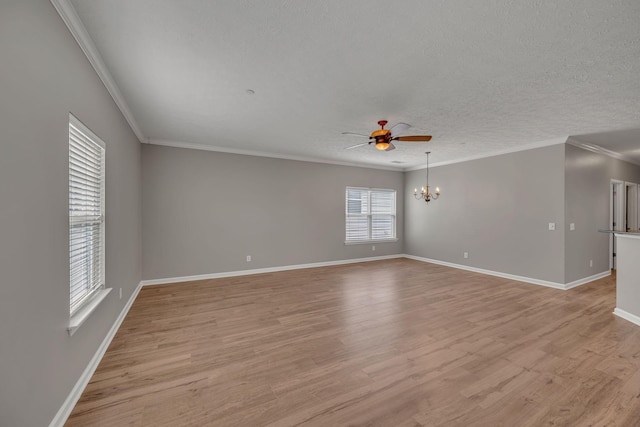 1033 Park Run Dr, Franklin, TN 37067 - unfurnished room with a ceiling fan, light wood-type flooring, a chandelier, ornamental molding, and a textured ceiling