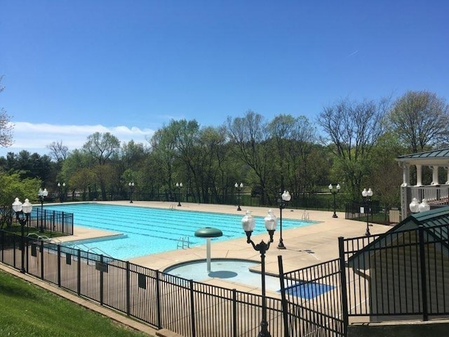 1033 Park Run Dr, Franklin, TN 37067 - community pool featuring a patio and view of wooded area
