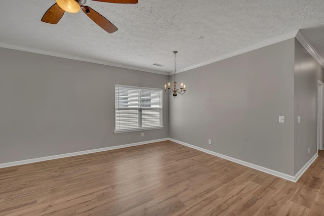 1033 Park Run Dr, Franklin, TN 37067 - empty room with wood finished floors, a ceiling fan, a chandelier, crown molding, and a textured ceiling