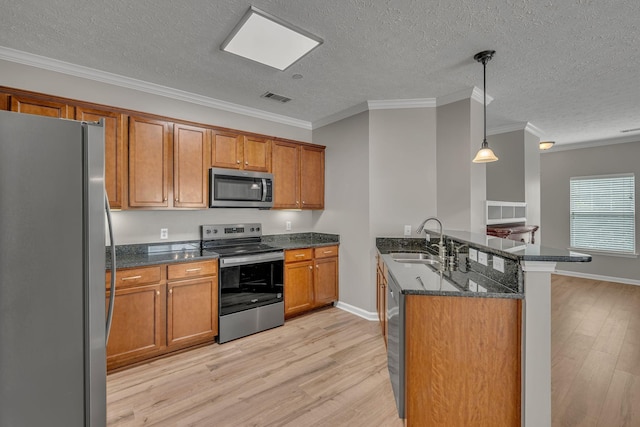 1033 Park Run Dr, Franklin, TN 37067 - kitchen with appliances with stainless steel finishes, light wood finished floors, brown cabinets, ornamental molding, and a textured ceiling