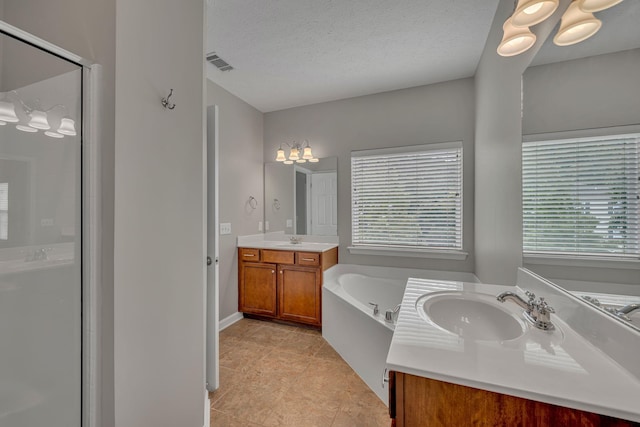 1033 Park Run Dr, Franklin, TN 37067 - full bathroom featuring two vanities, a garden tub, a shower stall, tile patterned floors, and a textured ceiling