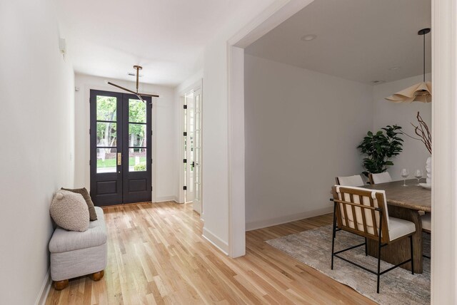 322 Starling Ln, Franklin, TN 37064 - foyer entrance with light wood finished floors and french doors