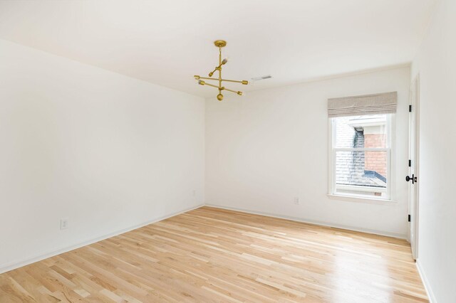 322 Starling Ln, Franklin, TN 37064 - empty room with a chandelier and light wood-style floors