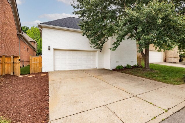 322 Starling Ln, Franklin, TN 37064 - view of front of home featuring brick siding, driveway, a shingled roof, and an attached garage