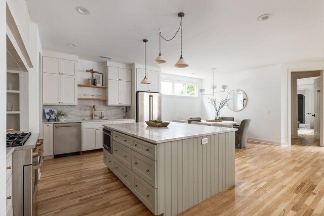 322 Starling Ln, Franklin, TN 37064 - kitchen with stainless steel appliances, open shelves, light wood-style floors, white cabinets, and recessed lighting