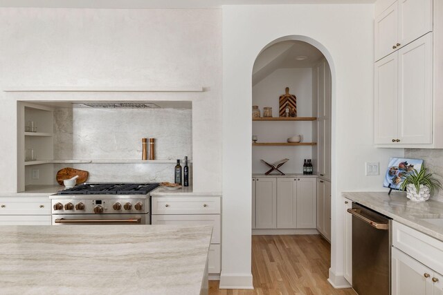 322 Starling Ln, Franklin, TN 37064 - kitchen featuring appliances with stainless steel finishes, light wood-type flooring, open shelves, white cabinets, and backsplash