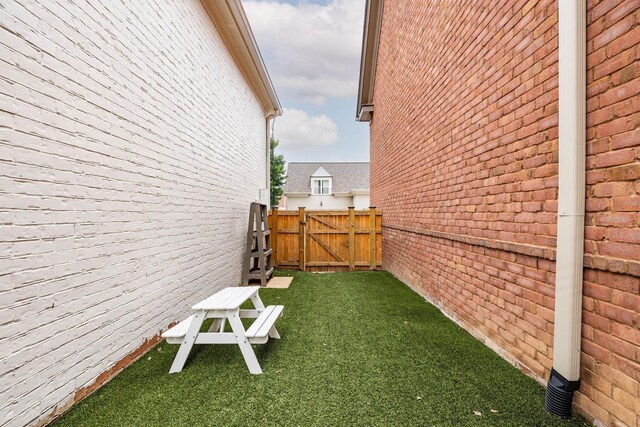 322 Starling Ln, Franklin, TN 37064 - view of property exterior with brick siding and a gate