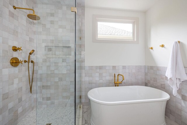322 Starling Ln, Franklin, TN 37064 - full bathroom featuring a tile shower, tile walls, a freestanding bath, and wainscoting