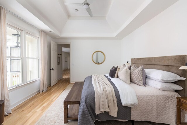 322 Starling Ln, Franklin, TN 37064 - bedroom with a raised ceiling and light wood-type flooring