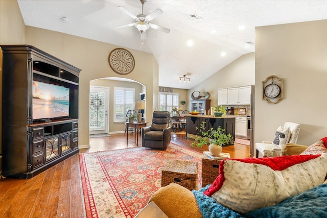 395 Devon Chase Hl Unit 5502, Gallatin, TN 37066 - living area with arched walkways, ceiling fan, light wood finished floors, and lofted ceiling