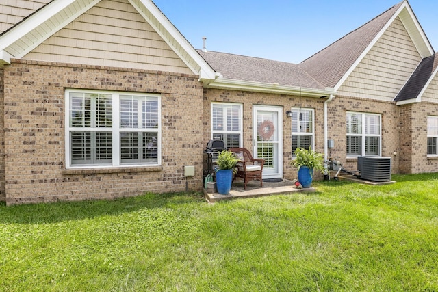 395 Devon Chase Hl Unit 5502, Gallatin, TN 37066 - doorway to property with brick siding, a yard, roof with shingles, and a patio