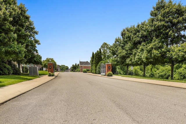 395 Devon Chase Hl Unit 5502, Gallatin, TN 37066 - view of asphalt road with sidewalks, curbs, and a gate