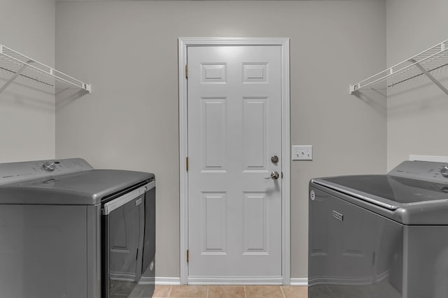 7352 Hidden Lake Cir, Fairview, TN 37062 - laundry room featuring washer and dryer and light tile patterned flooring