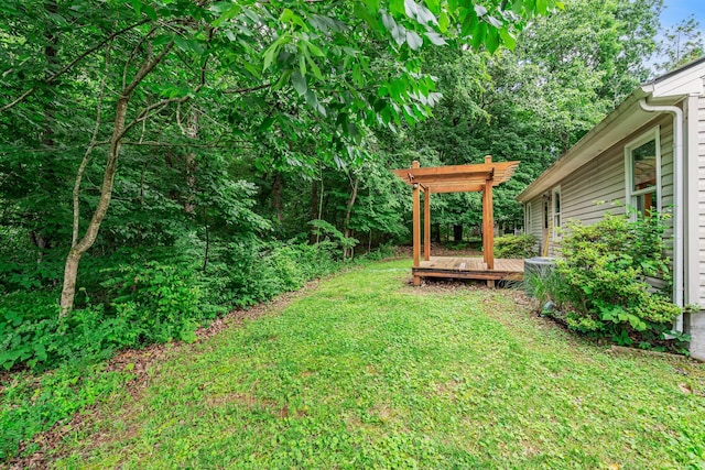 7352 Hidden Lake Cir, Fairview, TN 37062 - view of grassy yard featuring a wooden deck and a pergola