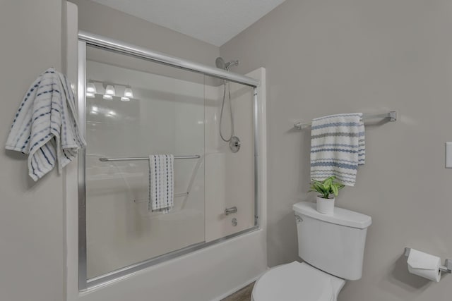 7352 Hidden Lake Cir, Fairview, TN 37062 - bathroom with toilet and bath / shower combo with glass door