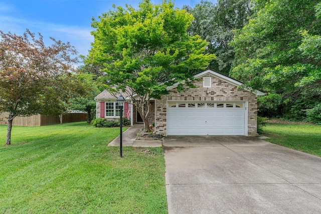 7352 Hidden Lake Cir, Fairview, TN 37062 - view of front of property featuring brick siding, driveway, and a garage