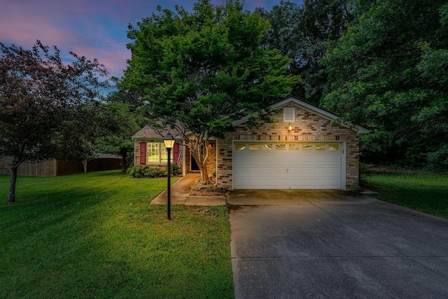 7352 Hidden Lake Cir, Fairview, TN 37062 - view of front facade featuring concrete driveway, a garage, and brick siding