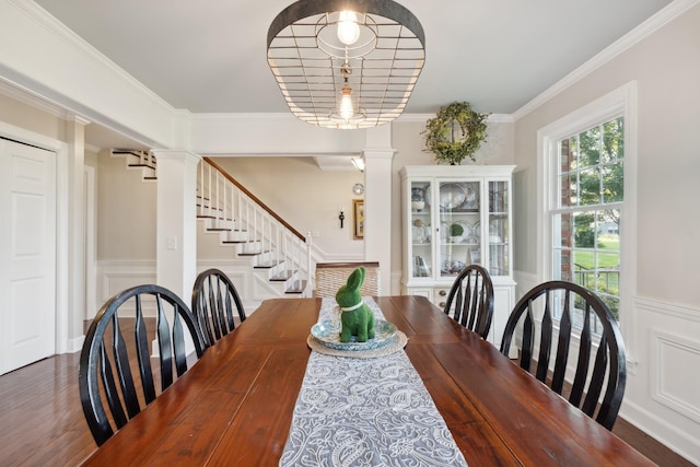 5013 Baker Rd, Murfreesboro, TN 37129 - dining room with ornate columns, a wainscoted wall, a decorative wall, stairs, and crown molding