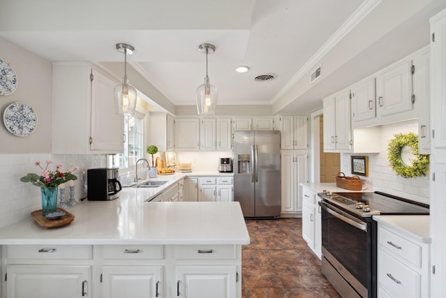 5013 Baker Rd, Murfreesboro, TN 37129 - kitchen featuring stainless steel appliances, a peninsula, backsplash, light countertops, and hanging light fixtures
