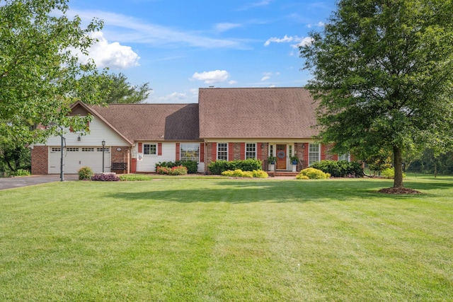 5013 Baker Rd, Murfreesboro, TN 37129 - new england style home with brick siding, asphalt driveway, a front yard, a garage, and a shingled roof