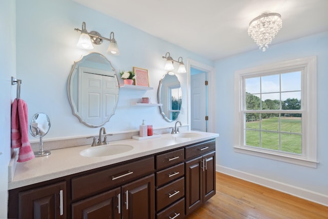 5013 Baker Rd, Murfreesboro, TN 37129 - full bathroom featuring double vanity, wood finished floors, and a chandelier