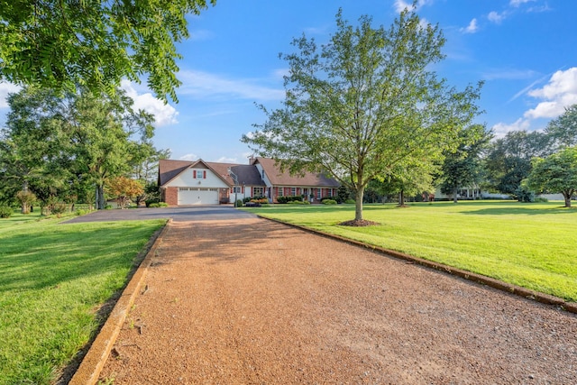 5013 Baker Rd, Murfreesboro, TN 37129 - view of front facade featuring dirt driveway, a front yard, and an attached garage