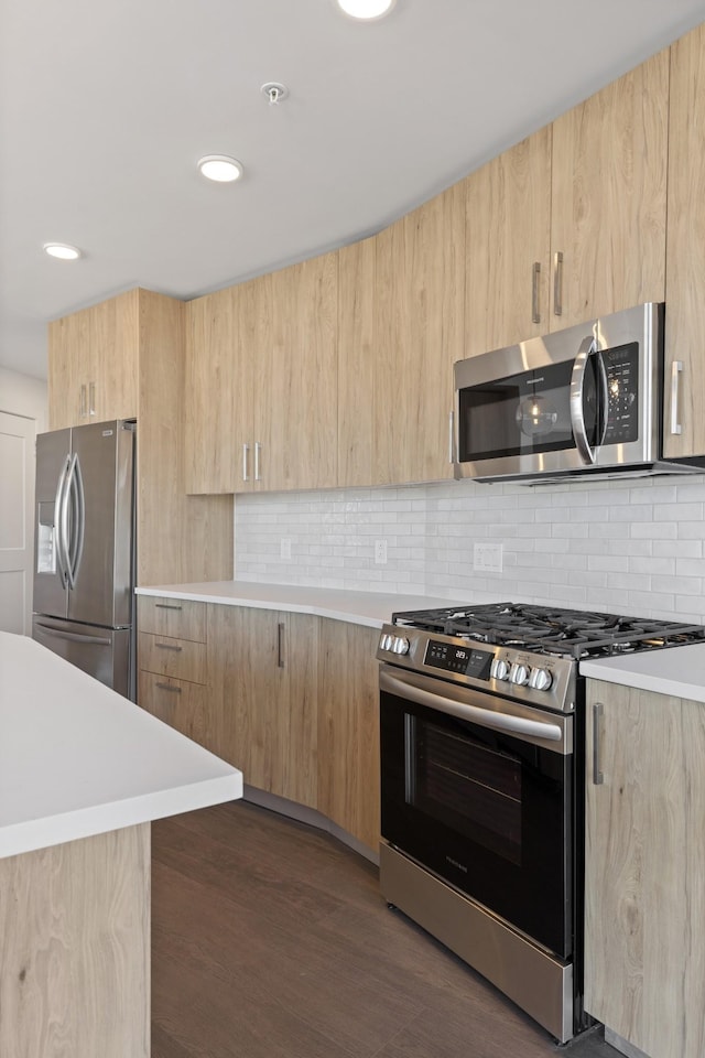 1212 Demonbreun St Unit C3-D I, Nashville, TN 37203 - kitchen featuring stainless steel appliances, light brown cabinetry, modern cabinets, light countertops, and recessed lighting