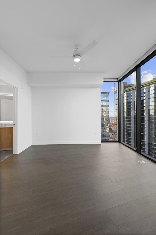 1212 Demonbreun St Unit C3-D I, Nashville, TN 37203 - empty room featuring ceiling fan, floor to ceiling windows, and dark wood-style flooring