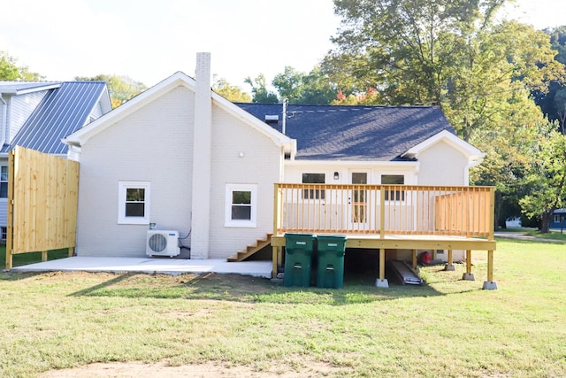 413 E Main St, Waverly, TN 37185 - rear view of house with brick siding, a chimney, a deck, a yard, and stairway