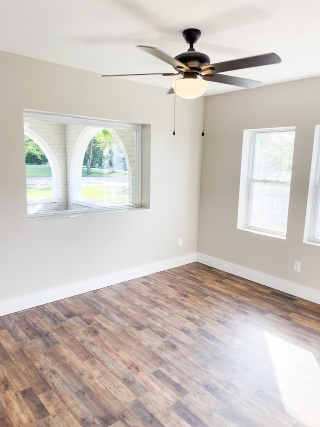 413 E Main St, Waverly, TN 37185 - empty room featuring ceiling fan and wood finished floors