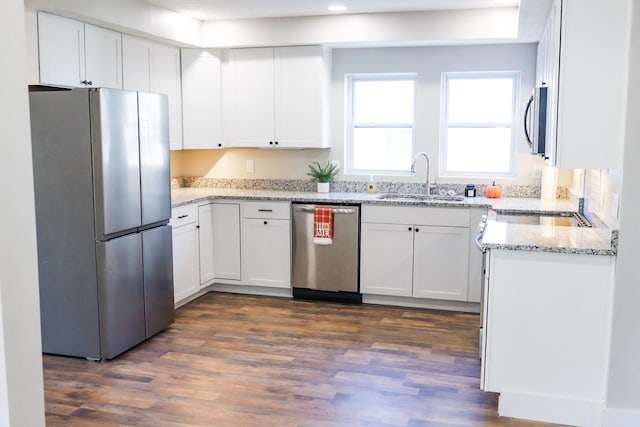 413 E Main St, Waverly, TN 37185 - kitchen featuring appliances with stainless steel finishes, dark wood-style floors, white cabinets, light stone counters, and recessed lighting