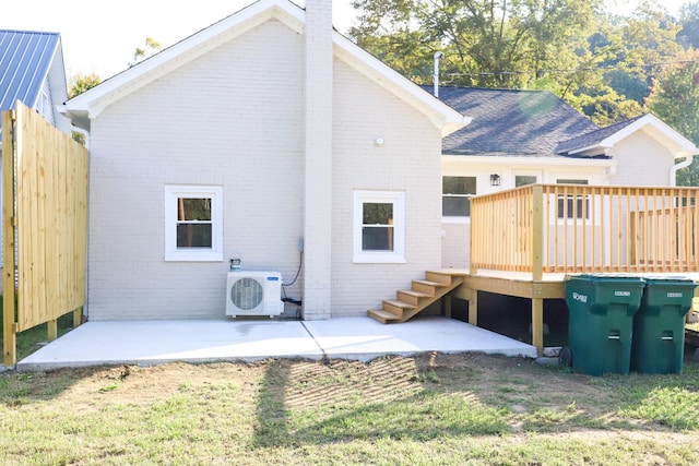 413 E Main St, Waverly, TN 37185 - back of property featuring brick siding, stairway, a deck, and a chimney