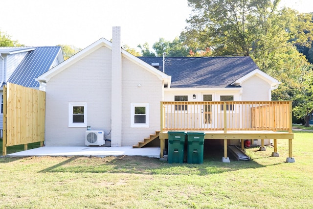 413 E Main St, Waverly, TN 37185 - back of property featuring stairs, brick siding, a deck, a lawn, and a patio area