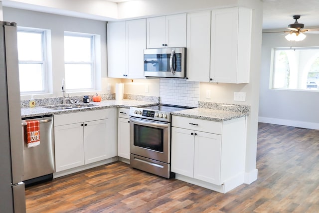 413 E Main St, Waverly, TN 37185 - kitchen featuring stainless steel appliances, dark wood-style floors, white cabinets, and ceiling fan