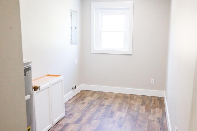413 E Main St, Waverly, TN 37185 - empty room with light wood-style floors and electric panel